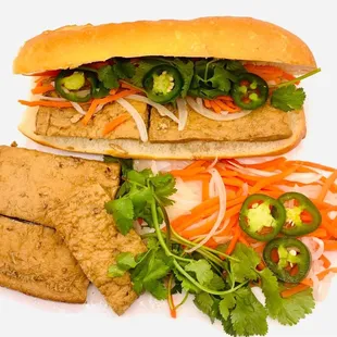 a sandwich with meat and vegetables
