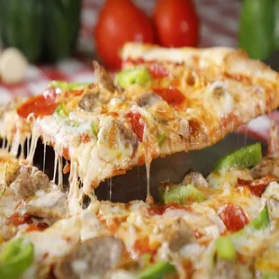 a slice being taken out of a pizza