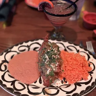 Chilli relleno and blood orange margarita (Notice the rice looks orange red, it wasn&apos;t it was normal Spanish rice color)