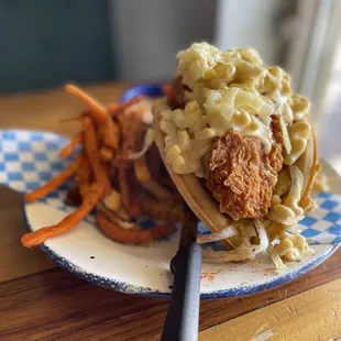 Mac n&apos; cheese fried chicken tender waffle sandwich