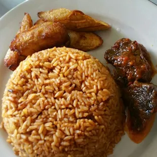Jollof rice, plantains and goat? I think