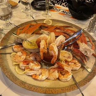  a platter of shrimp and crab legs