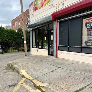 the corner of a street with a fire hydrant
