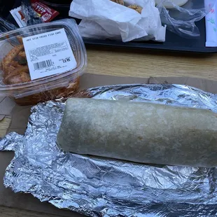 Mama Cho's KBBQ burrito with spicy fish cake on the side.