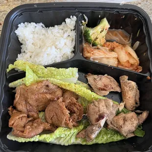 Bland chicken and spicy pork with mushy rice. Lost my taste midway eating.