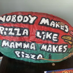 a pizza sign on a table