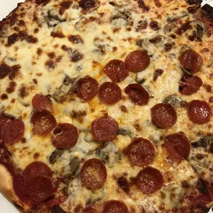 Mushroom half pepperoni Cimino crust pizza