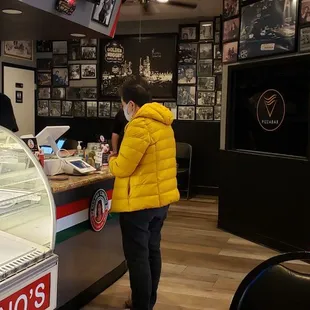 Ordered Caesar salad plus a Supreme pizza.  Our first visit here.  Surrounded with family photos.