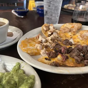 Combination beef, chicken, and shrimp fajita nachos...