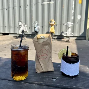 two drinks on a picnic table