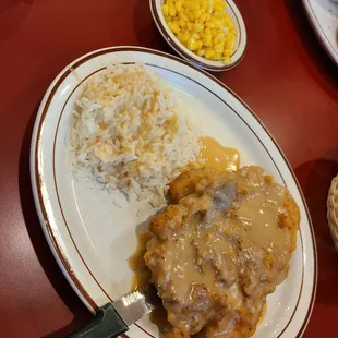 Fried pork chops - rice with gravy - yellow corn