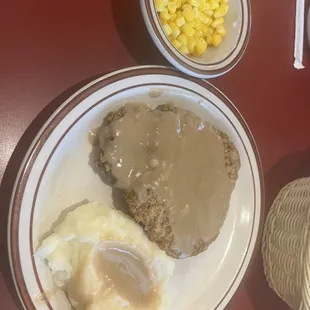 Chicken fried steak, mashed potatoes and corn