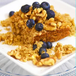 Baked Oatmeal with fresh blueberries, walnuts and brown sugar sprinkled on top