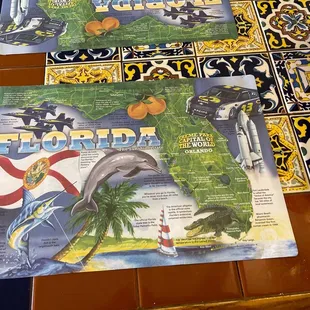 a bottle of soda and a menu