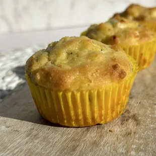 two muffins on a cutting board