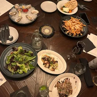 Grilled octopus  oysters  mixed greens