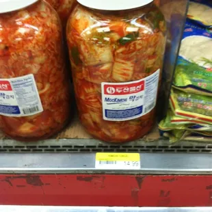 three jars of pickled vegetables