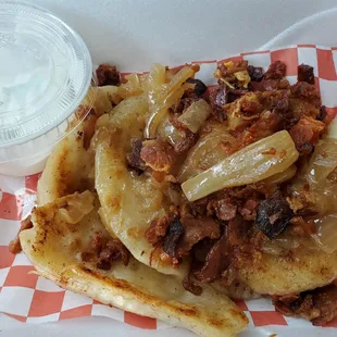 Pan fried sauerkraut &amp; potato pierogi with caramelized onions and crispy bacon