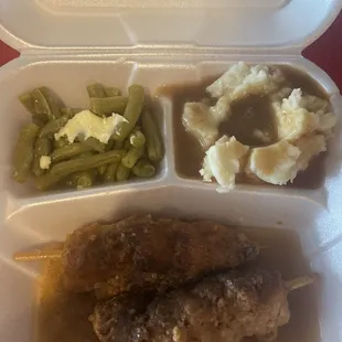 City Chicken(no chicken)2 tender pork loin cut into cubes on skewer, breaded, deep fried, whipped potatoes, gravy and vegetable