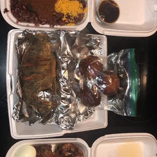 2 Wakkye(rice &amp; Beans) Plate platters with a side of fish in middle