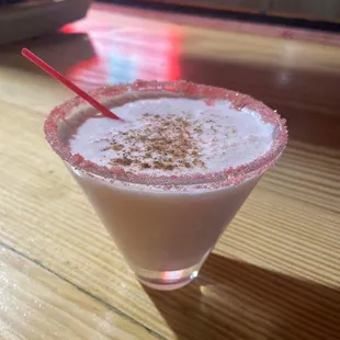 a drink in a glass on a table