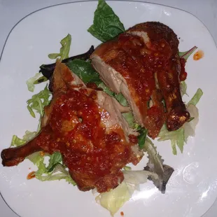 a plate of food with meat and lettuce