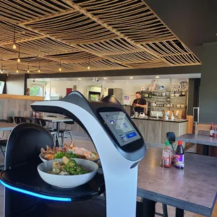 a table with a bowl of salad on it