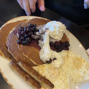 Pancakes with blueberries, sausage  and 2 eggs over easy