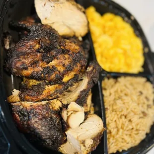 Jerk chicken dinner with rice and peas and Mac and cheese