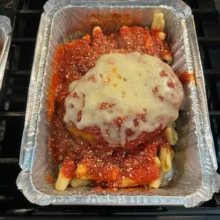 a tray of lasagna with cheese on top