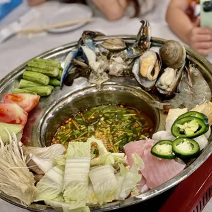 a platter of seafood and vegetables