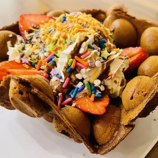 Chocolate bubble mochi waffle with toppings