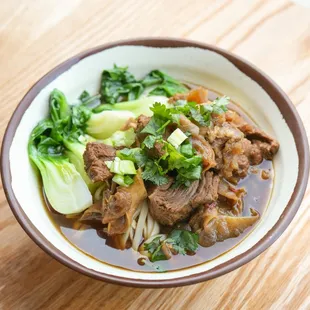 a bowl of beef and noodles