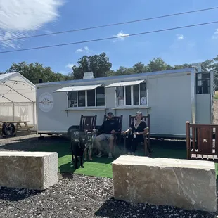 two people and a dog