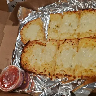 two slices of bread in foil