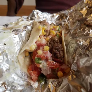 beef taco with lots of fixings and queso. Date loved it!