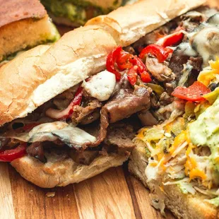 a steak sandwich on a cutting board