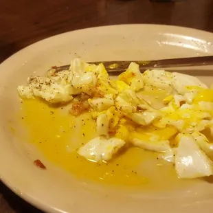 a plate of eggs and bread