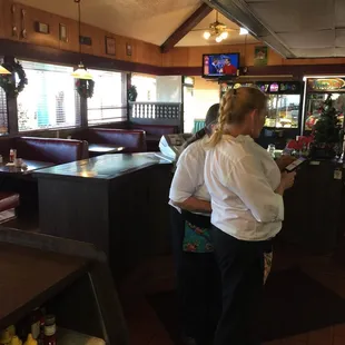 a woman standing in a restaurant