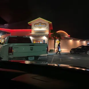 a woman walking in the parking lot