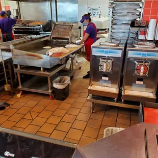 She's making tortillas back there!