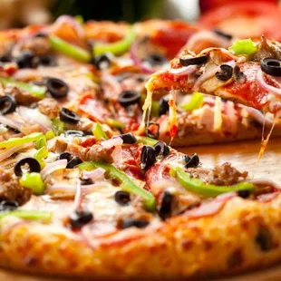 a pizza on a cutting board