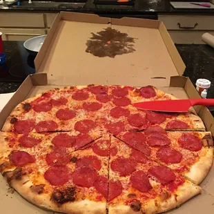 24 inch pizza!! This was massive! Cutting job of the slices could have been better but it was good pizza.