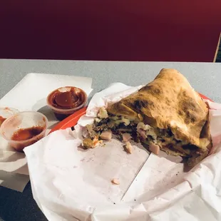 Meat Mania Calzone. It's a big Calzone! The cold Marinara sauce they serve with it ruined my appetite