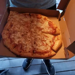 Cheese in the corner of the box. Nice delivery guy. Needs better manager