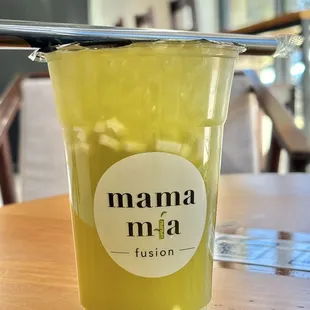 a cup of juice on a table