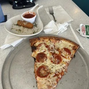 Mozzarella Sticks and slice of pepperoni pizza