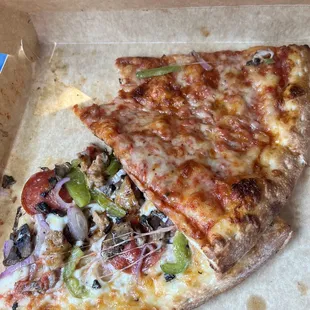 two slices of pizza in a box