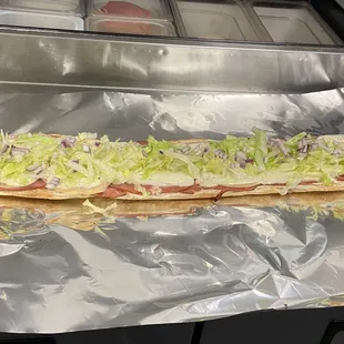 a long sub sandwich on tin foil