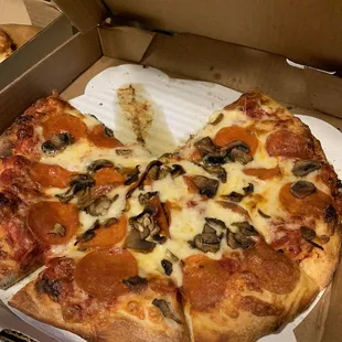 Medium pepperoni and mushroom pizza